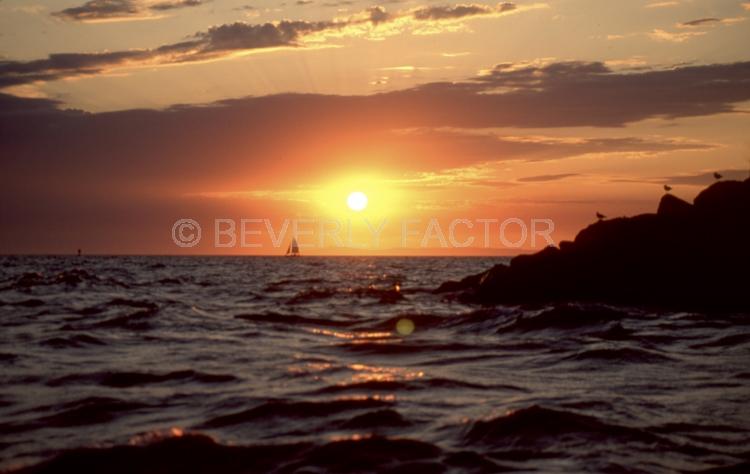 Sunset;colorful;sky;dana point;clouds;blue water;sun;yellow;red;sillouettes;blue;sailboats;ocean